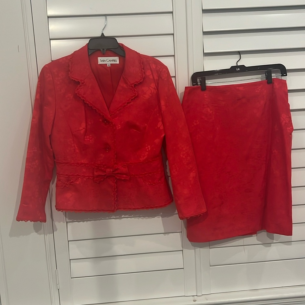 Sara Campbell red suit